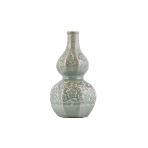 344A - A LONGQUAN CELADON DOUBLE GOURD VASE  元代 龙泉贴花瓜棱葫芦瓶  China, Yuan dynasty  A sculpted structure adorne... 