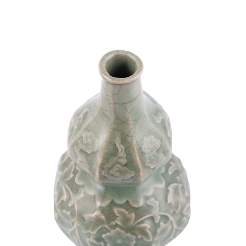 344A - A LONGQUAN CELADON DOUBLE GOURD VASE  元代 龙泉贴花瓜棱葫芦瓶  China, Yuan dynasty  A sculpted structure adorne... 