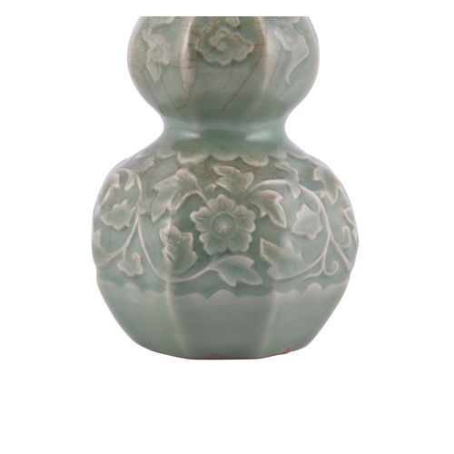 344A - A LONGQUAN CELADON DOUBLE GOURD VASE  元代 龙泉贴花瓜棱葫芦瓶  China, Yuan dynasty  A sculpted structure adorne... 