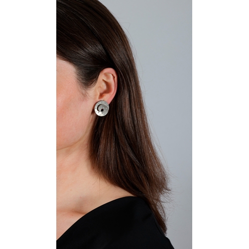 12 - MARGHERITA BURGENER: A PAIR OF DIAMOND AND TITANIUM EARRINGS  Each spiralled open hoop, highlighted ... 