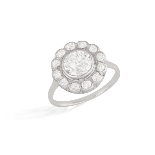 130 - AN EARLY 20TH CENTURY DIAMOND RING  Of target design, the cluster centring a European-cut diamond we... 