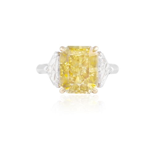 133 - PIRANESI: A FANCY COLOURED DIAMOND AND DIAMOND RING  The rectangular-cut Fancy Deep Yellow diamond, ... 