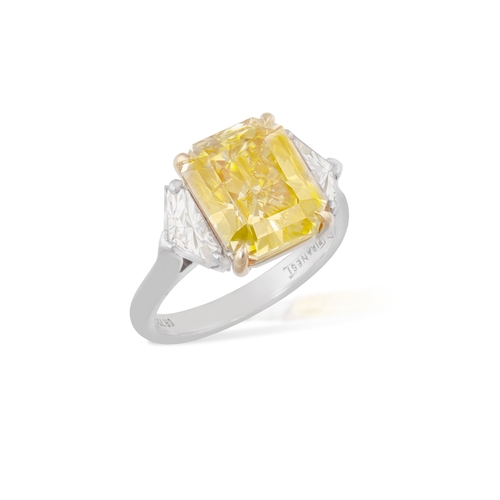 133 - PIRANESI: A FANCY COLOURED DIAMOND AND DIAMOND RING  The rectangular-cut Fancy Deep Yellow diamond, ... 