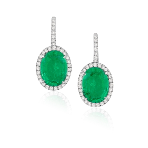 136 - A PAIR OF EMERALD AND DIAMOND EARRINGS  Each set with an oval-shaped emerald, framed by brilliant-cu... 