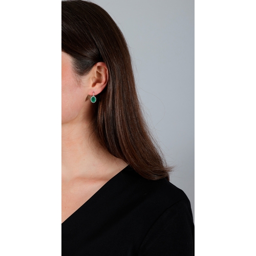 136 - A PAIR OF EMERALD AND DIAMOND EARRINGS  Each set with an oval-shaped emerald, framed by brilliant-cu... 