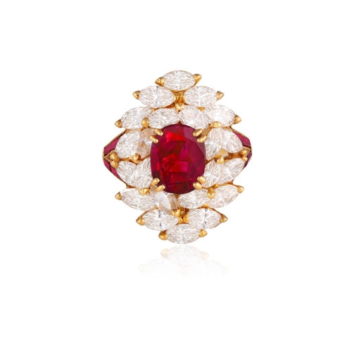 140 - MAUBOUSSIN: A RUBY AND DIAMOND CLUSTER RING  The central oval-shaped ruby weighing approximately 2.0... 