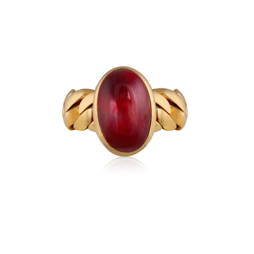 151 - POMELLATO: A GARNET RING  The oval-shaped cabochon garnet within collet and closed-back -setting, to... 