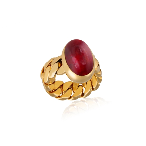 151 - POMELLATO: A GARNET RING  The oval-shaped cabochon garnet within collet and closed-back -setting, to... 