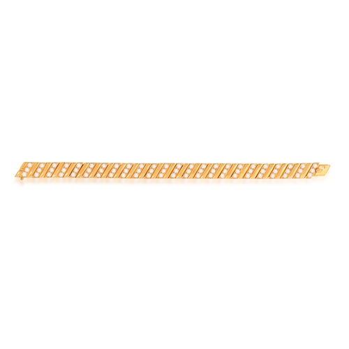 161 - VAN CLEEF & ARPELS: A FINE DIAMOND BRACELET, CIRCA 1990   Of articulated design, composed of polishe... 