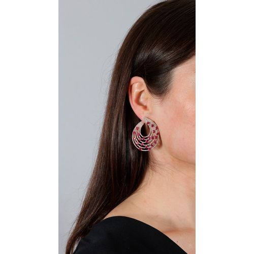 162 - A PAIR OF RUBY AND DIAMOND EARRINGS  Each composed of five graduated concentric hoops, pavé-set with... 