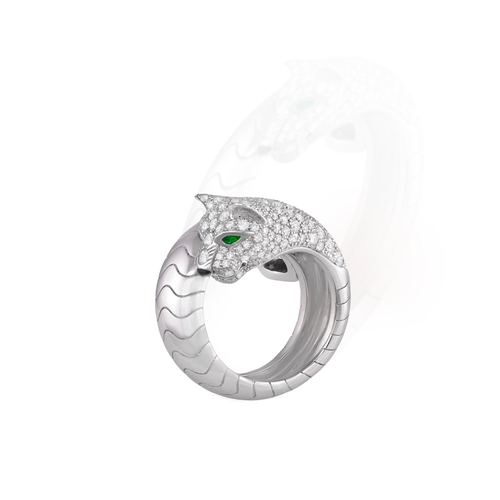 169 - CARTIER: A DIAMOND AND EMERALD 'PANTHÈRE' DRESS RING, FRENCH

The sprung ring designed as a panther,... 