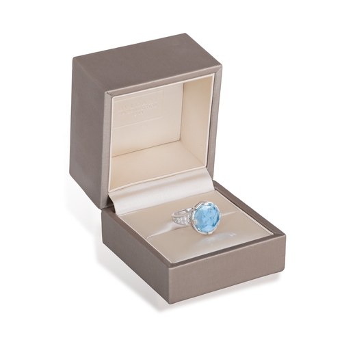 171 - BVLGARI: A BLUE TOPAZ AND DIAMOND ‘PARENTESI’ RING   Set with a rose-faceted circular-shaped blue to... 