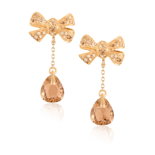 175 - POMELLATO: A PAIR OF SMOKEY QUARTZ AND DIAMOND PENDENT EARRINGS  Each stylised tried ribbon bow surm... 