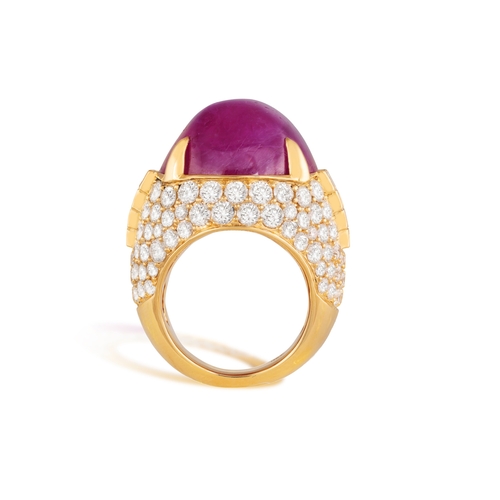 178 - BULGARI: AN IMPORTANT RUBY AND DIAMOND DRESS RING  Composed of a cushion-shaped cabochon ruby, withi... 