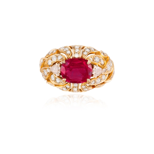 179 - A RUBY AND DIAMOND DRESS RING   Centring a claw-set cushion-shaped ruby weighing approximately 2.60c... 