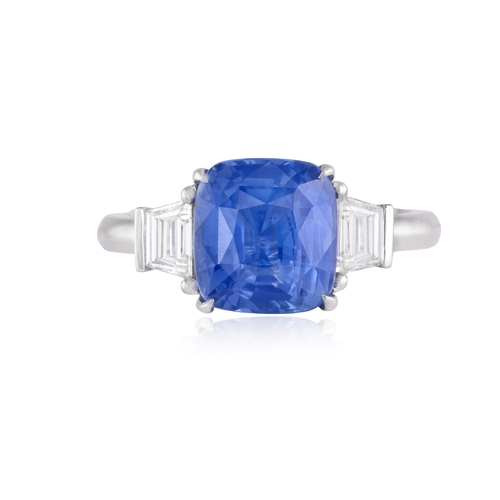 183 - A SAPPHIRE AND DIAMOND DRESS RING  The cushion-shaped sapphire weighing approximately 4.00cts, withi... 