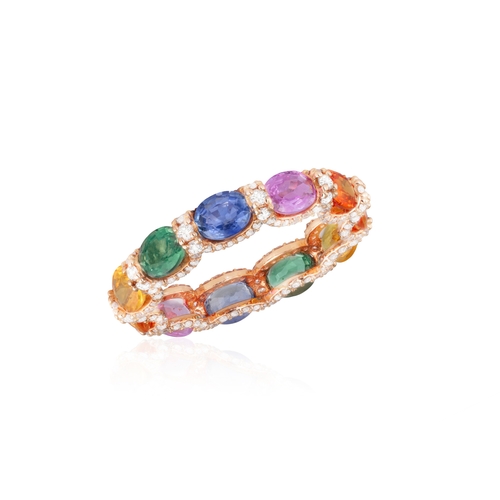 192 - A MULTI-COLOURED SAPPHIRE AND DIAMOND ETERNITY RING  The continuous row of oval-shaped sapphires of ... 