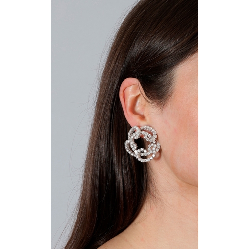 200 - A PAIR OF DIAMOND EARRINGS  Of openwork scrolling design, set with brilliant-cut diamonds throughout... 