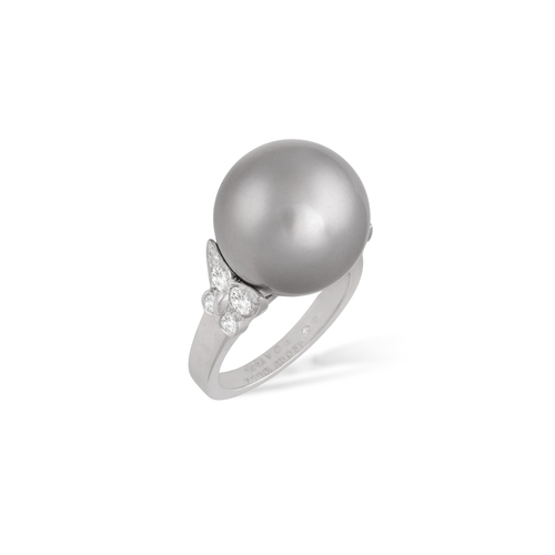 202 - VAN CLEEF & ARPELS: A CULTURED PEARL AND DIAMOND DRESS RING  The round-shaped Tahitian cultured pear... 