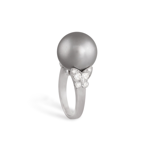 202 - VAN CLEEF & ARPELS: A CULTURED PEARL AND DIAMOND DRESS RING  The round-shaped Tahitian cultured pear... 