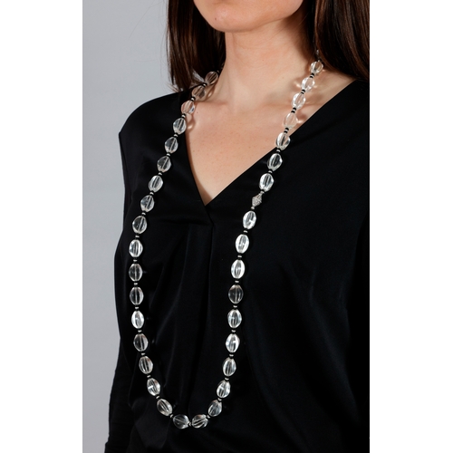 206 - A ROCK CRYSTAL, ONYX AND DIAMOND SAUTOIR NECKLACE  Composed of fluted rock crystal beads, interspers... 