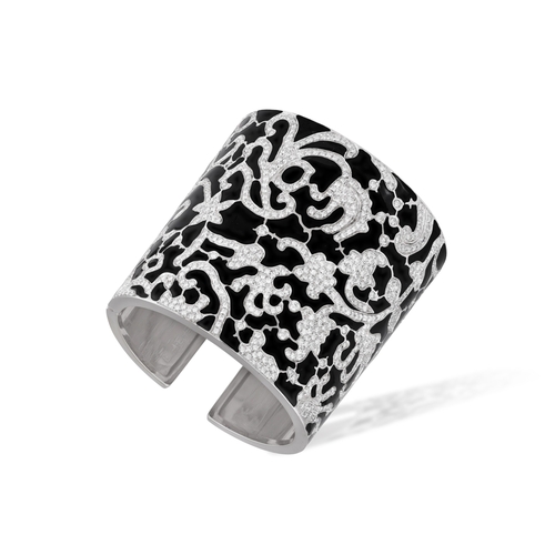 207 - A DIAMOND AND ENAMEL CUFF BRACELET  The cuff with a meandering design pavé-set with brilliant-cut di... 