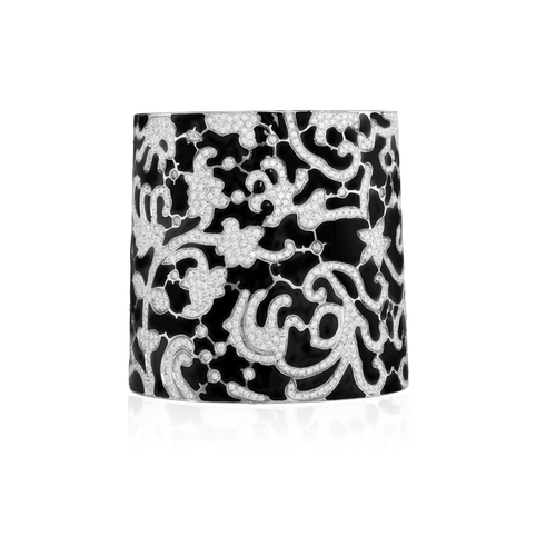 207 - A DIAMOND AND ENAMEL CUFF BRACELET  The cuff with a meandering design pavé-set with brilliant-cut di... 