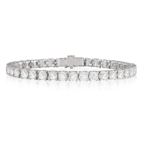 231 - A DIAMOND LINE BRACELET  Composed of a continuous line of brilliant-cut diamonds within claw-setting... 