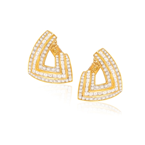 238 - A PAIR OF DIAMOND EARRINGS  Of openwork bombé design, each set with square and baguette-cut diamonds... 