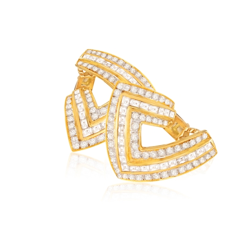 238 - A PAIR OF DIAMOND EARRINGS  Of openwork bombé design, each set with square and baguette-cut diamonds... 