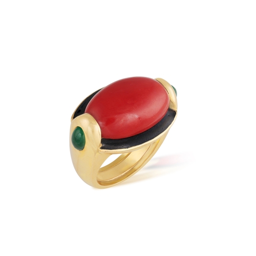 243 - A CORAL, EMERALD AND ENAMEL COCKTAIL RING   The horizontal oval-shaped mount set with an oval-shaped... 