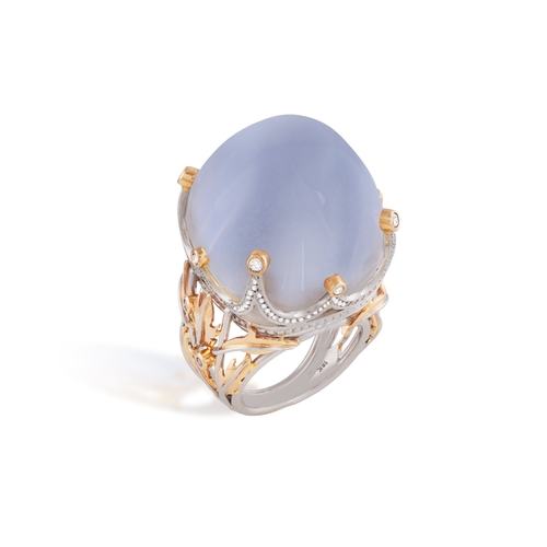 248 - A MOONSTONE AND DIAMOND COCKTAIL RING  The cushion-shaped moonstone cabochon weighing approximately ... 