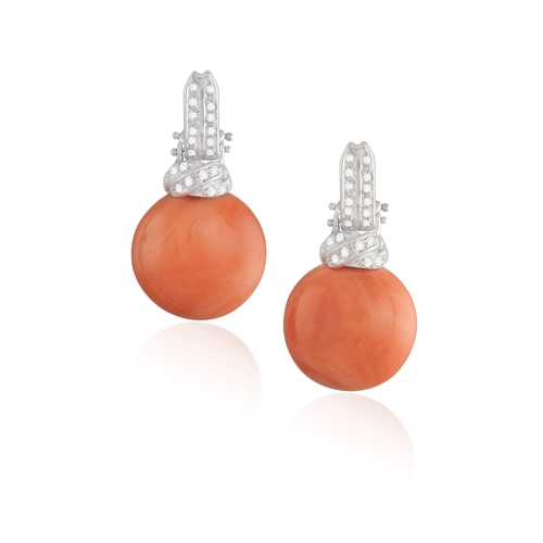 257 - A PAIR OF CORAL AND DIAMOND PENDENT EARRINGS  Each set with circular-shaped coral cabochon, suspende... 