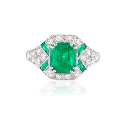 48 - AN EARLY ART DECO EMERALD AND DIAMOND DRESS RING, CIRCA 1920  The cut-cornered rectangular-cut emera... 