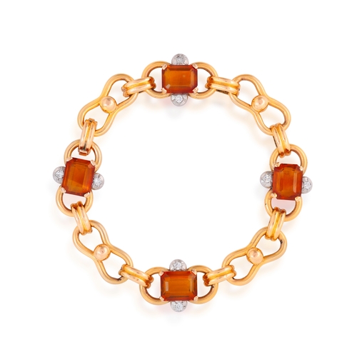 63 - A CITRINE AND DIAMOND BRACELET, CIRCA 1955
The fancy-link chain, highlighted with rectangular-cut ci... 