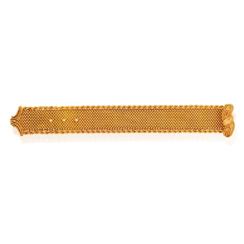 64 - A MID-20TH CENTURY GOLD JARRETIÈRE BRACELET, FRENCH, CIRCA 1955  Composed of a woven strap with rope... 