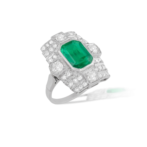 71 - AN EMERALD AND DIAMOND DRESS RING  The cut-cornered rectangular-cut emerald, within an old single-cu... 