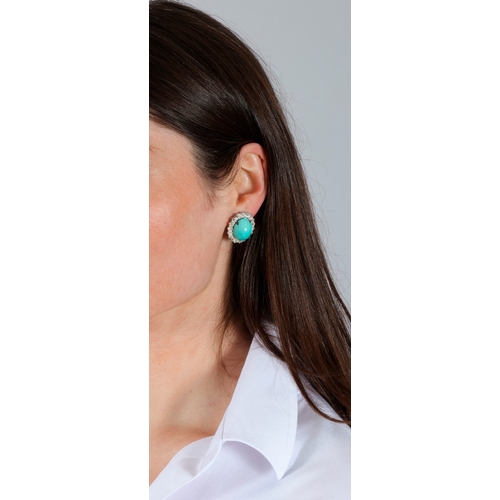 73 - A PAIR OF TURQUOISE AND DIAMOND EARCLIPS, CIRCA 1960   Each set with an oval-shaped cabochon turquoi... 