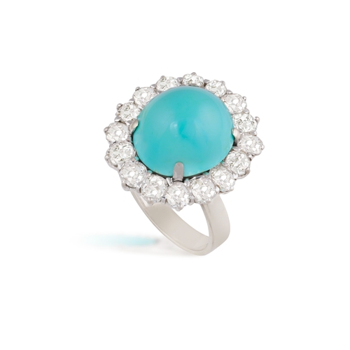 74 - A TURQUOISE AND DIAMOND RING, CIRCA 1960  Centring a cabochon turquoise weighing approximately 13.00... 