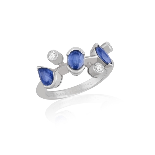 8 - CARTIER: A SAPPHIRE AND DIAMOND 'MÉLI MÉLO' RING, CIRCA 2002  The knife-wire band set with marquise ... 