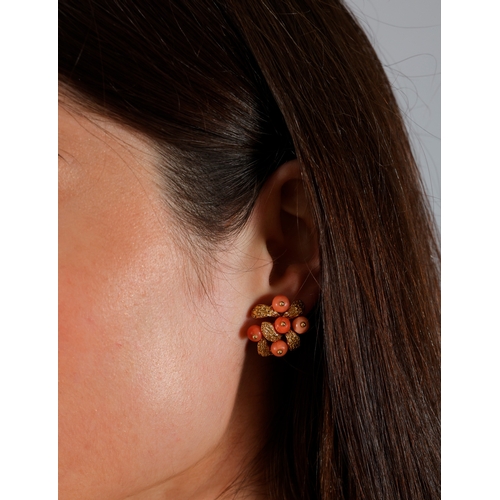 80 - VAN CLEEF & ARPELS: A PAIR OF CORAL EARCLIPS, CIRCA 1965-1970  Each textured gold cluster embellishe... 