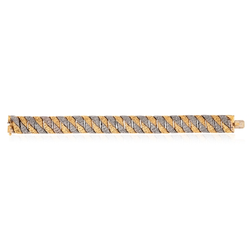 83 - GEORGES LENFANT FOR O.J PERRIN: A COLLECTIBLE BI-COLOURED GOLD BRACELET, CIRCA 1970

Composed of a s... 