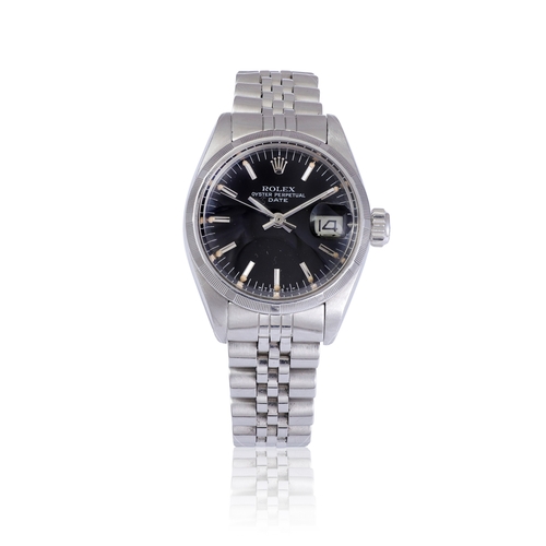 115 - ROLEX   REF. 6900, OYSTER PERPETUAL DATE  A stainless steel, self winding lady’s wristwatch with dat... 