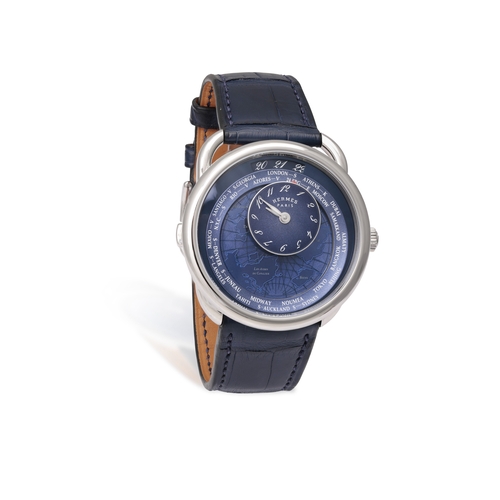 27 - HERMÈS  REF. AR10.510, ARCEAU, LE TEMPS VOYAGEUR, BLUE DIAL  A stainless steel world timer wristwatc... 