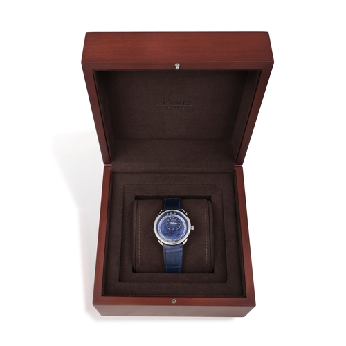 27 - HERMÈS  REF. AR10.510, ARCEAU, LE TEMPS VOYAGEUR, BLUE DIAL  A stainless steel world timer wristwatc... 