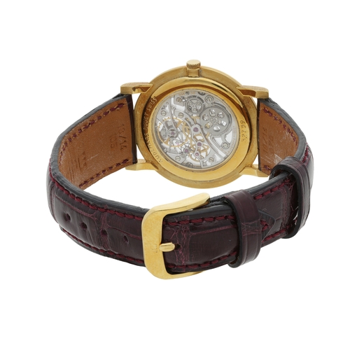 62 - AUDEMARS PIGUET  ULTRA-THIN SKELETON  A well-preserved, 18k yellow gold Ultra-Thin skeletonised manu... 