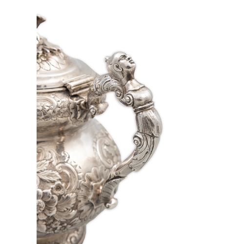 101 - AN IRISH SILVER GEORGE IV TEAPOT,   Dublin 1821, mark of William Nolan, with flower head finial, the... 