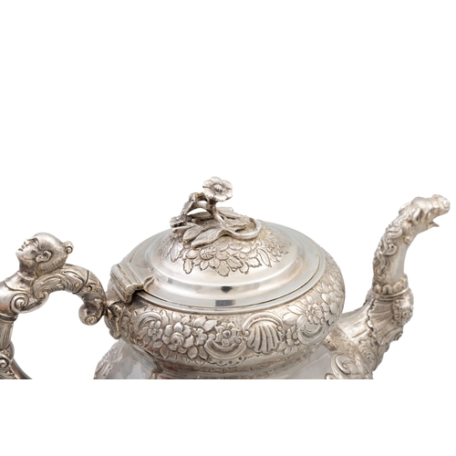 101 - AN IRISH SILVER GEORGE IV TEAPOT,   Dublin 1821, mark of William Nolan, with flower head finial, the... 