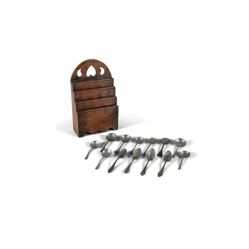 115 - A 19TH CENTURY TIMBER SPOON RACK,   of rectangular upright form, the domed back with pierced heart d... 