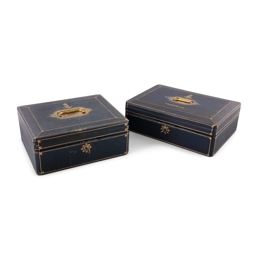 123 - TWO EDWARDIAN NAVY BLUE AND GILT DECORATED LEATHER COVERED BOXES BY A. ARMSTRONG OF DUBLIN,   both w... 